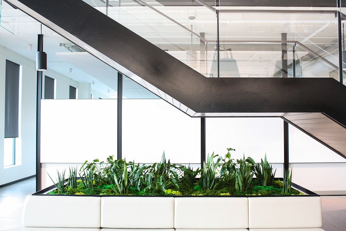 Planted seating area under the stairs