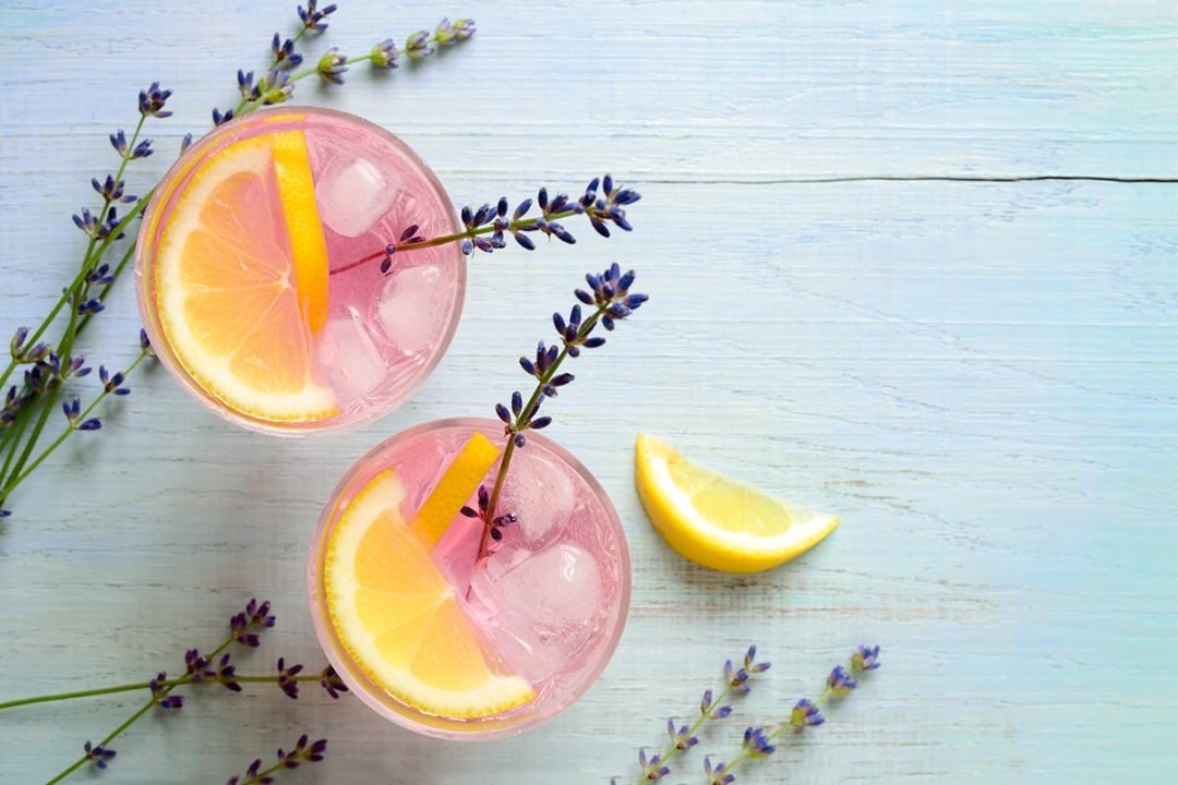 Pink cocktail with homegrown herbs for cooking and cocktails