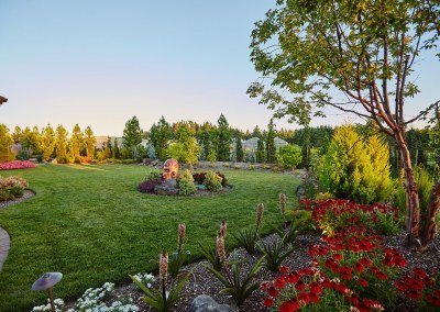 nice yard with lawn and plant beds