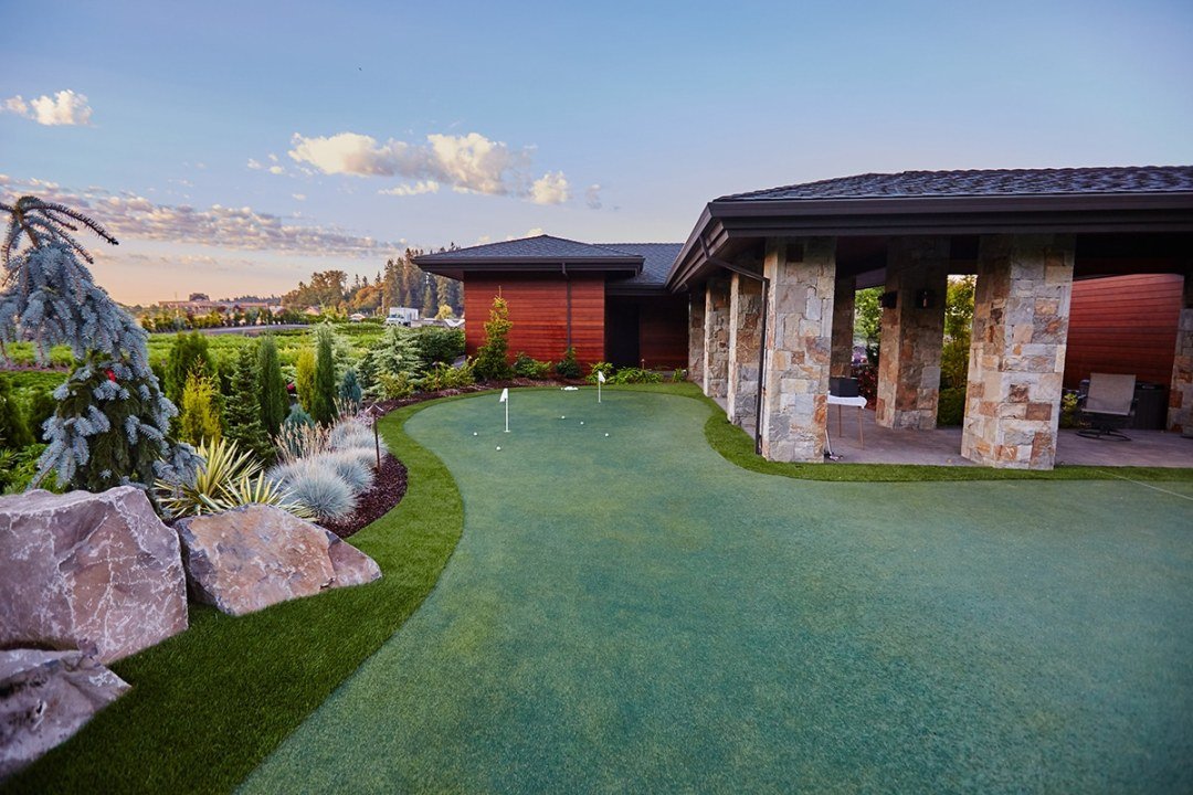 Golf putting green in home landscape by 7 Dees