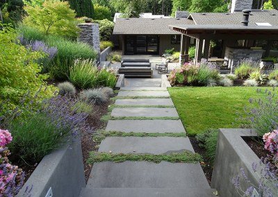 Smooth paver path with groundcover and plantings by Dennis' 7 Dees Landscaping