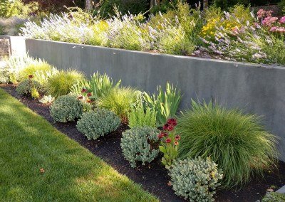 residential landscape border plantings and retaining wall