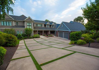 modern paver driveway by Dennis' 7 Dees Landscaping