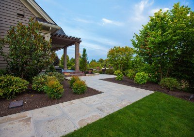 landscaped stone pathway around house