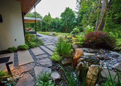portland home with paver path and water feature