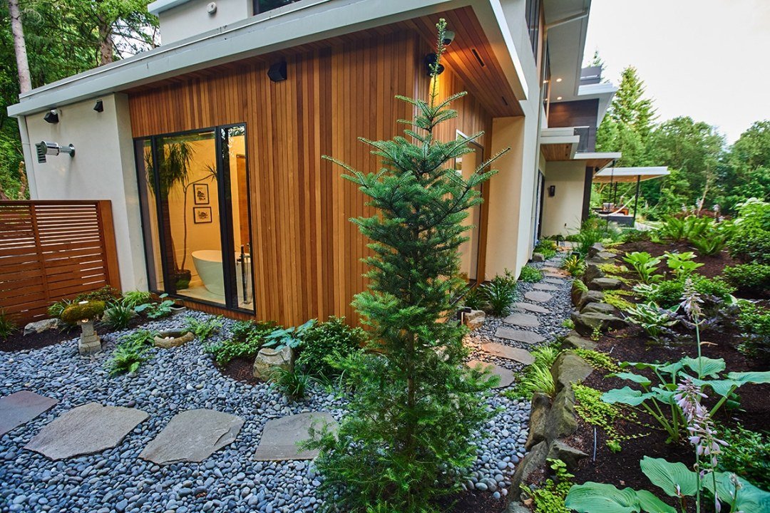 Natural stone path and shade plantings by Dennis' 7 Dees Landscaoing