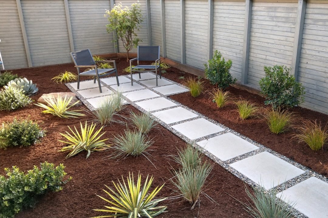 Side yard with walkway and chairs with plants - by Dennis' 7 Dees