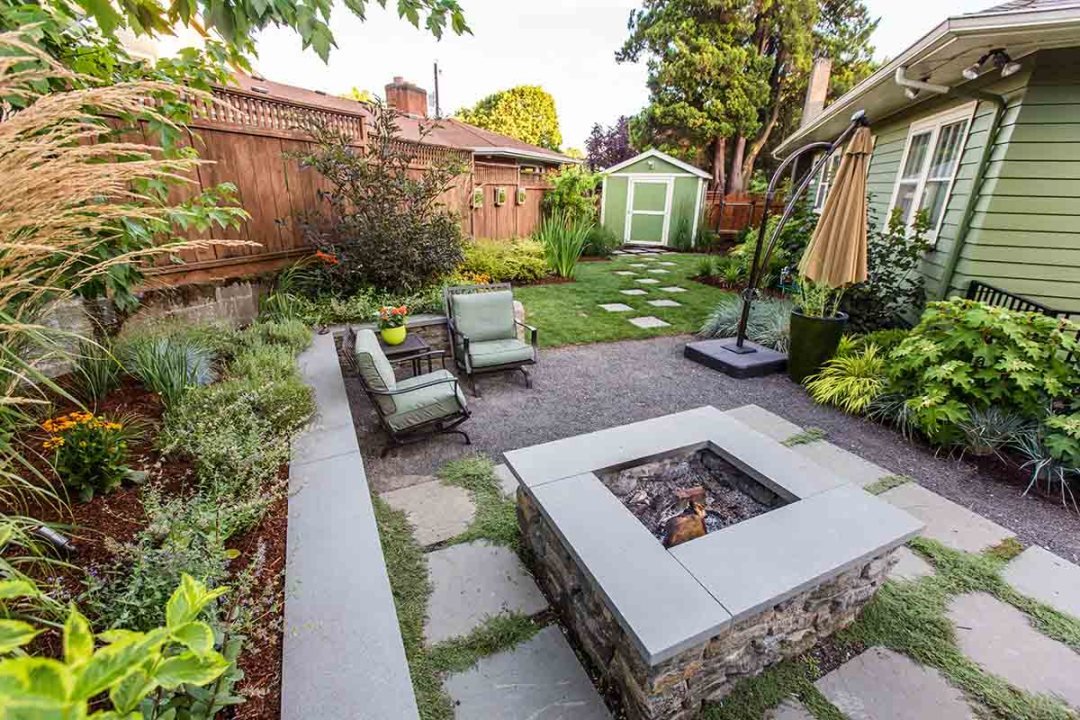 Fire pit and pathway in a side yard and plantings - By Dennis' 7 Dees