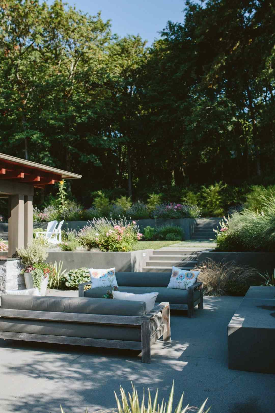 residential landscape design with patio and planting beds